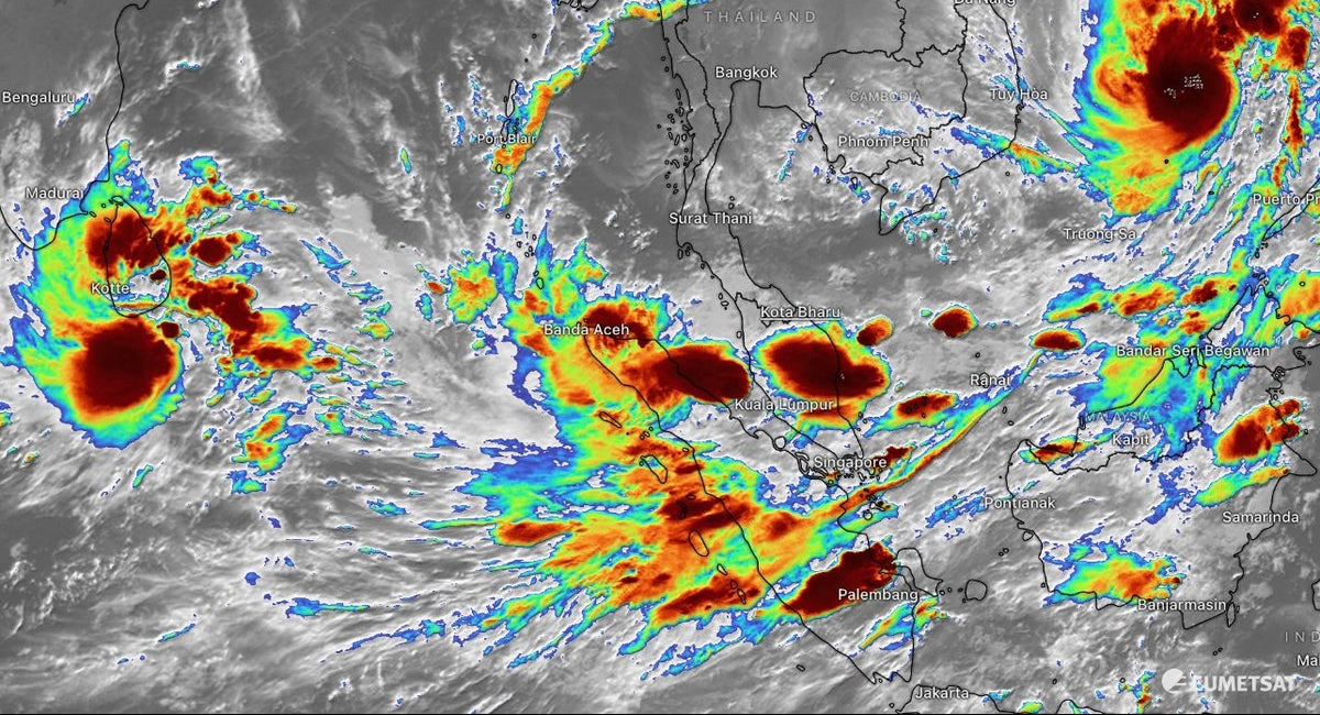 Satellite image of a tropical cyclone with color coding on a map of Asia.